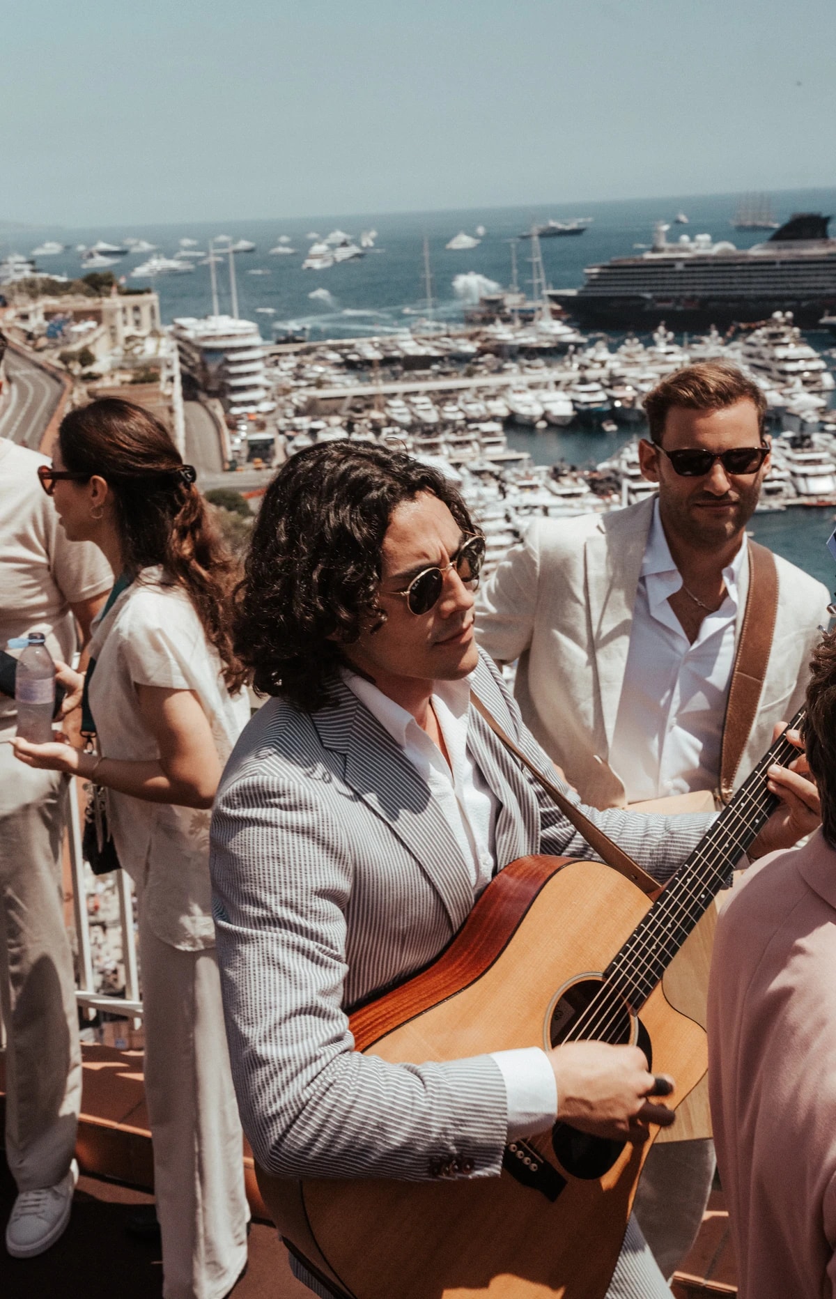 Empire guitarist performing above Monaco harbour during a destination event