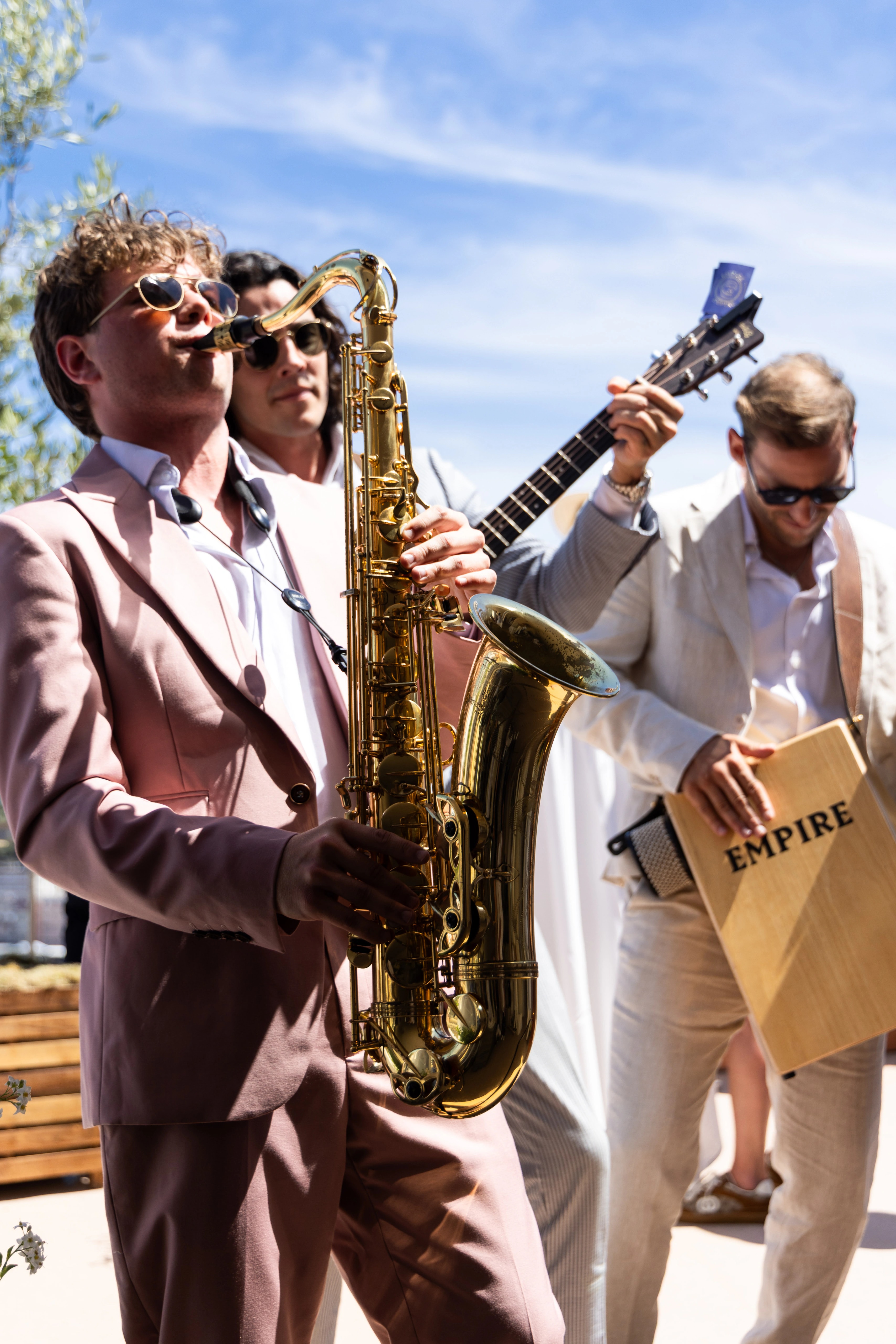 Empire's saxophonist and guitarist performing among guests above Monaco harbour